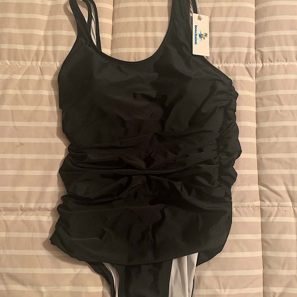 NWT ladies ruched black one-piece swimsuit. Large